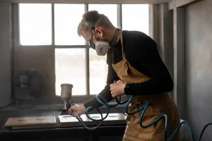 Blog High-volume powder coating production run — batch processing metal components NC